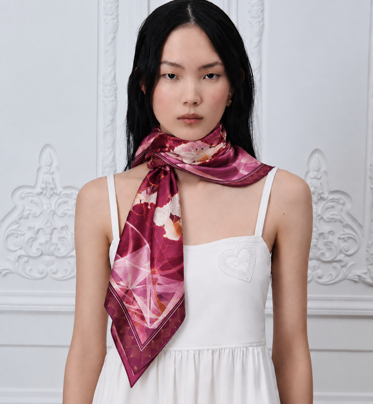 Red Lotus silk scarf by Nguyen Van Trinh styled around the neck