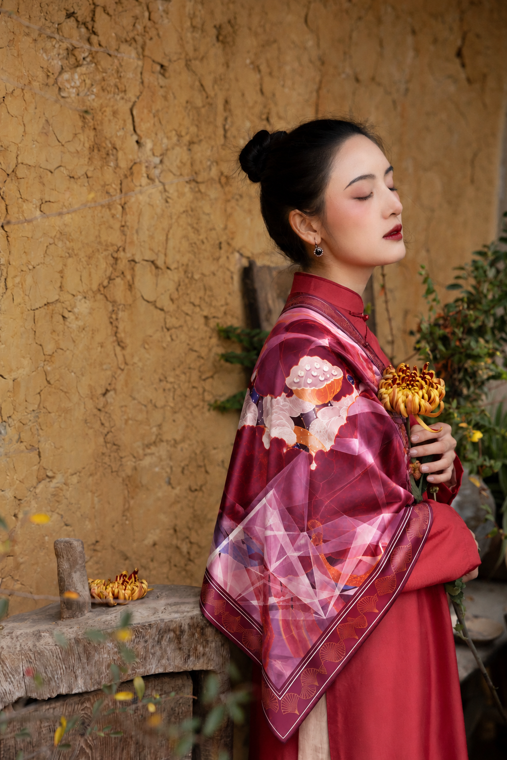 Red Lotus silk scarf by Nguyen Van Trinh styled with a traditional red outfit