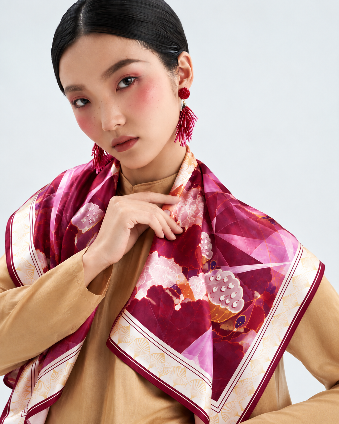 Lotus Geometry silk scarf styled over the shoulders
